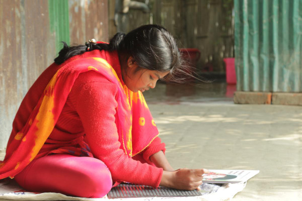 Indian woman writing
