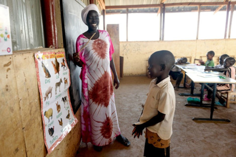 child and teacher at the blackboard