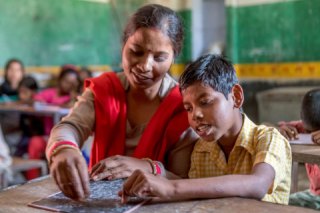 A teacher with her student