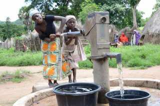 Two girls at a well in South Sudan