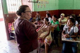 Teacher with students in classroom