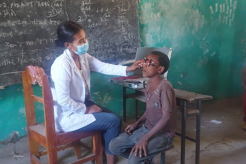 Nurse visiting a child at school